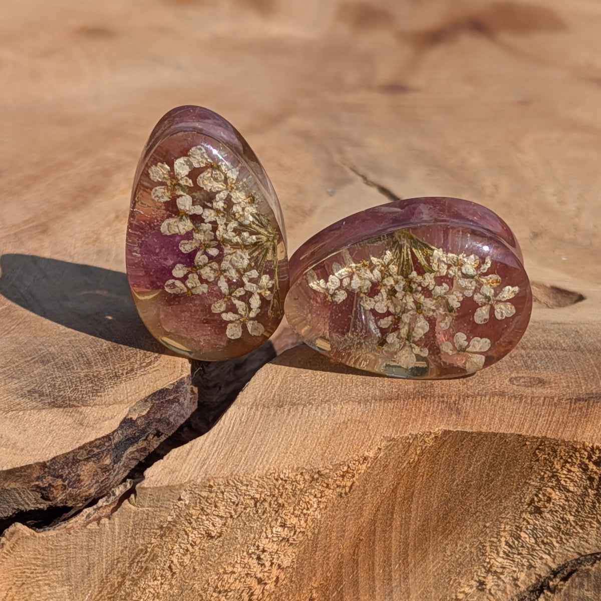 Handmade teardrop ear plugs featuring genuine black tourmaline and white flowers EL-Creations
