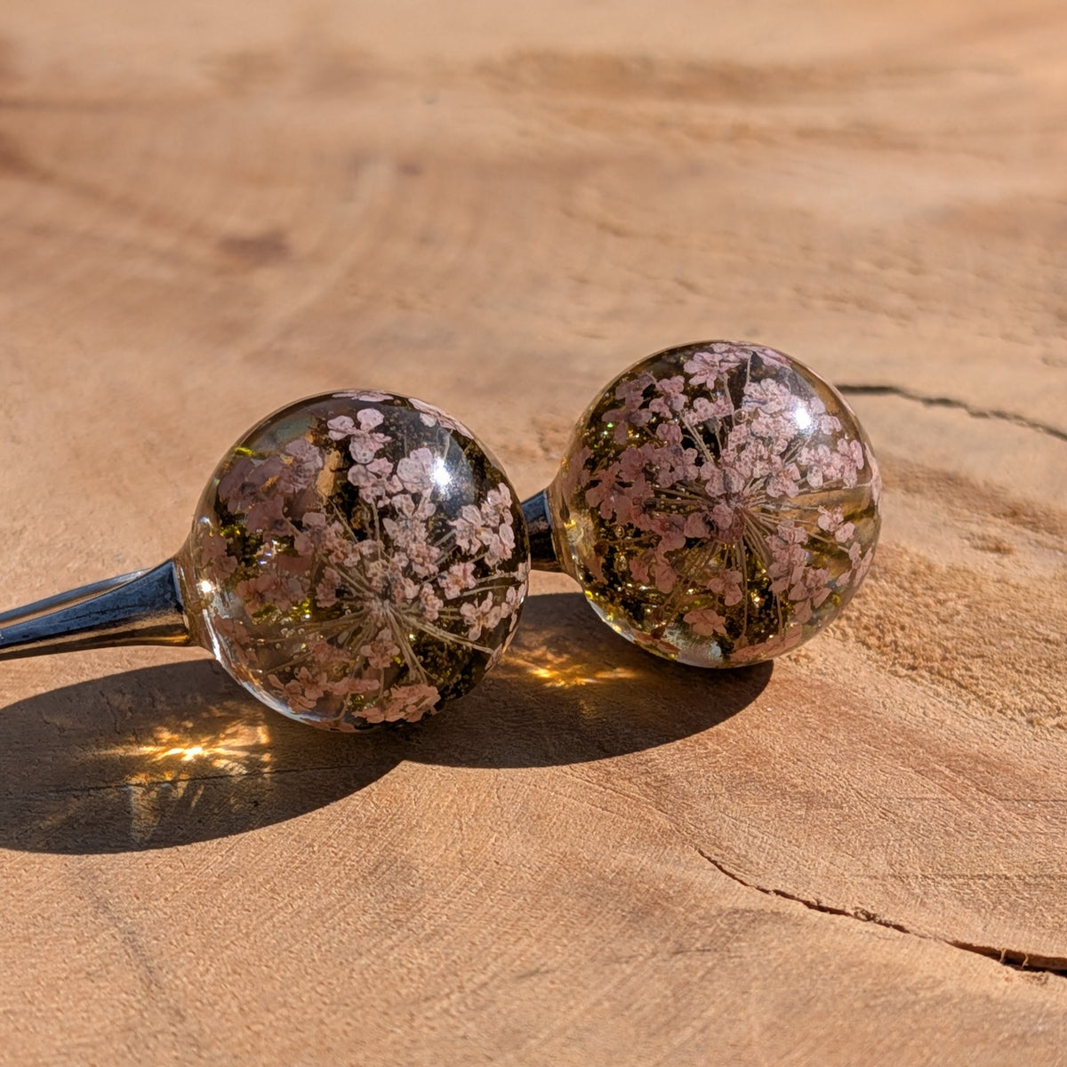 Real dried flower moss resin ball earrings 15mm on wooden surface, EL Creations