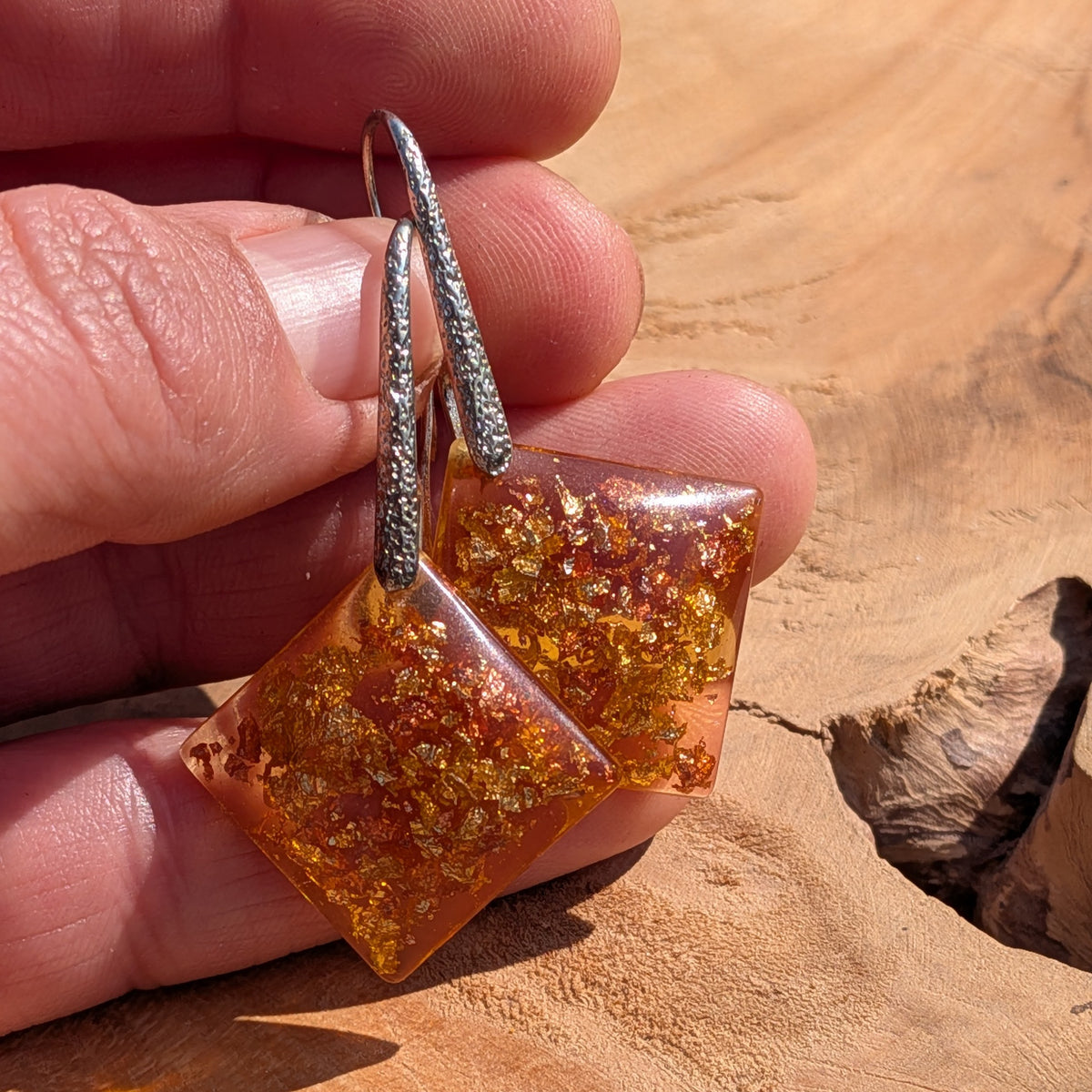 Handmade amber resin square earrings held in hand, 4.5cm statement dangle jewelry EL Creations Belgium