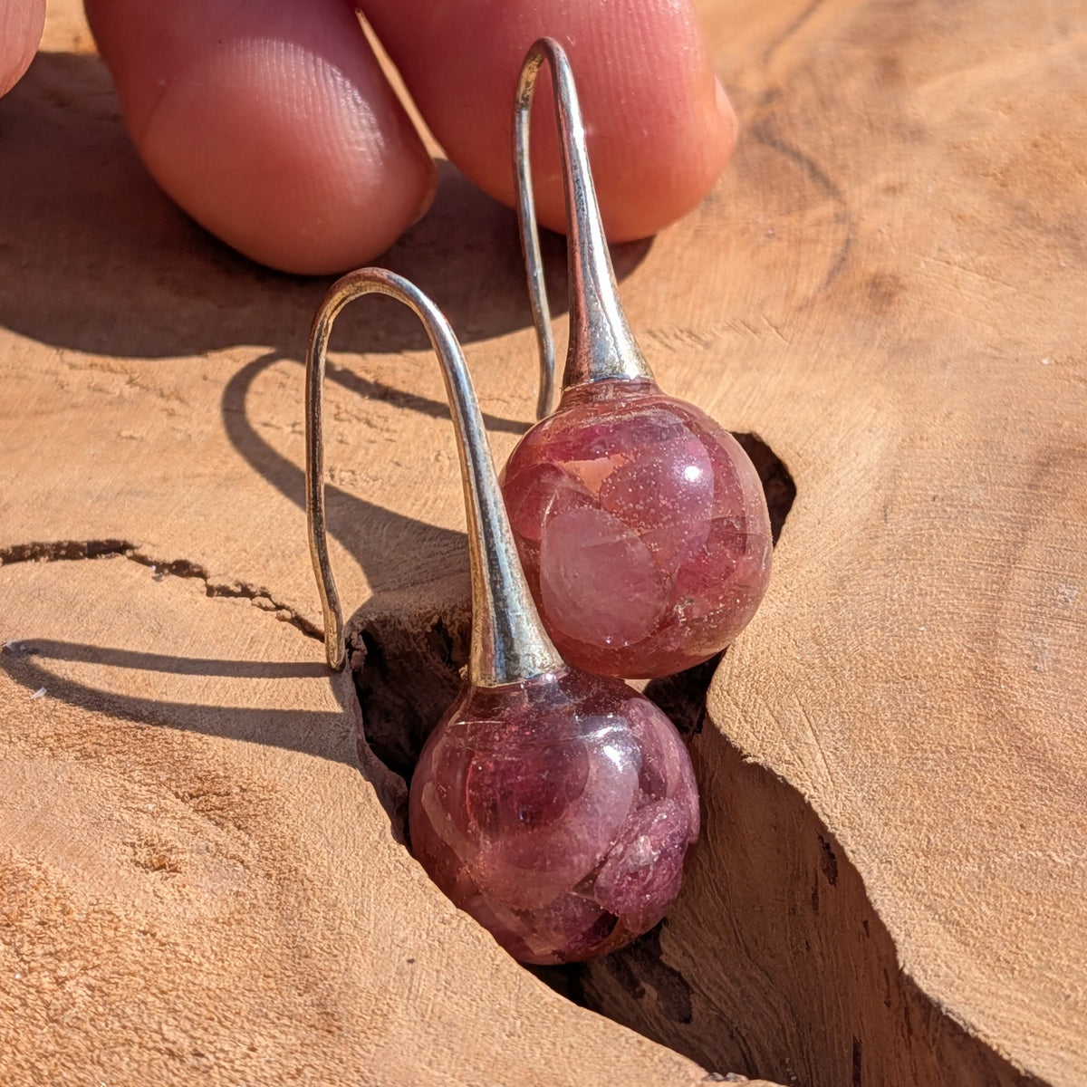 Pink tourmaline resin ball earrings top view, gemstone dangle jewelry handmade in Belgium