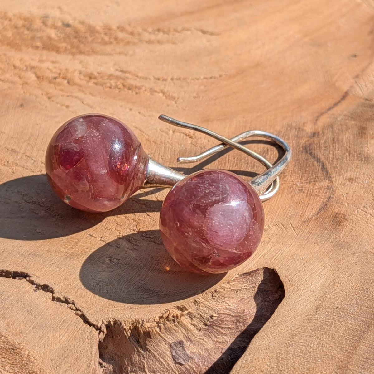 Handmade pink tourmaline resin ball earrings on wooden surface, 3cm dangle jewelry EL Creations Belgium