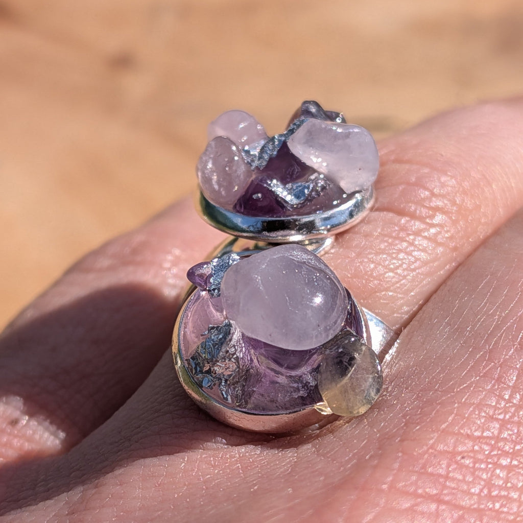 Amethyst and rose quartz bypass ring worn on hand, close-up of two raw crystal cluster settings – EL-Creations
