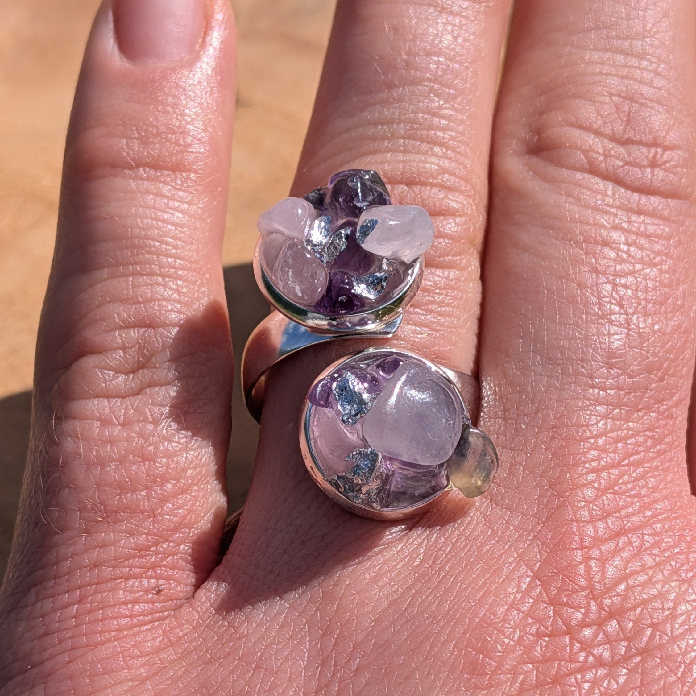 Amethyst rose quartz dual cluster bypass ring worn on hand, side view of two silver settings – EL-Creations