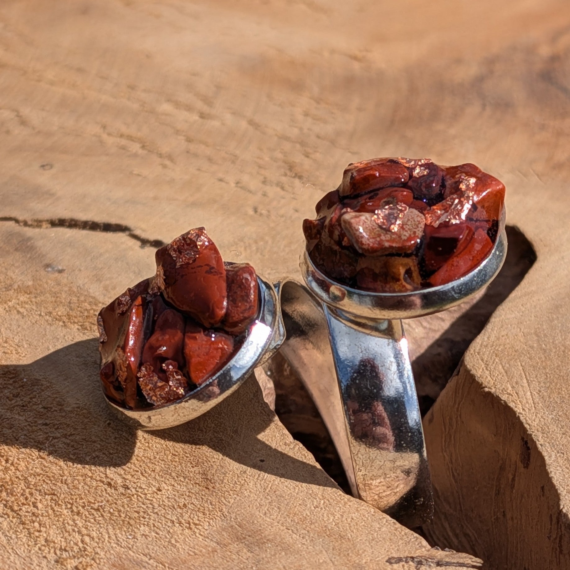 Red jasper double stone ring on sandy rock, side view of two round silver settings with raw jasper clusters – EL-Creations