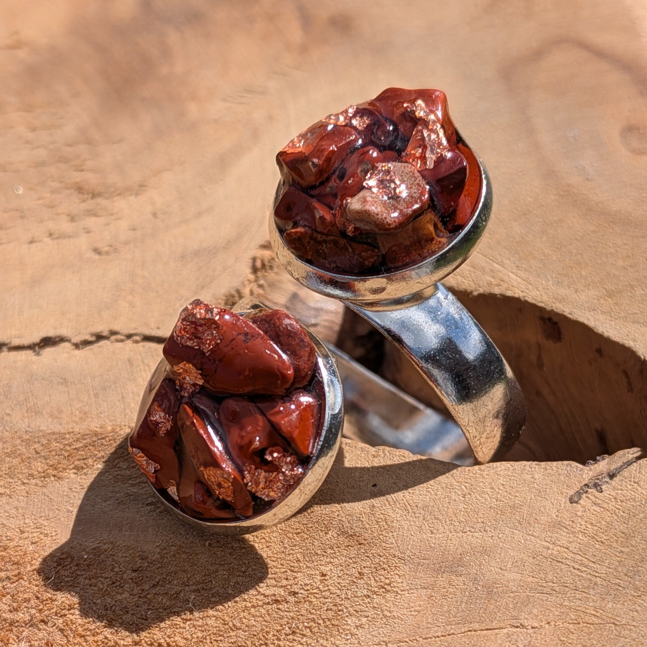 Red jasper double stone cluster ring worn on finger, close-up of two round settings with raw stone pieces – EL-Creations