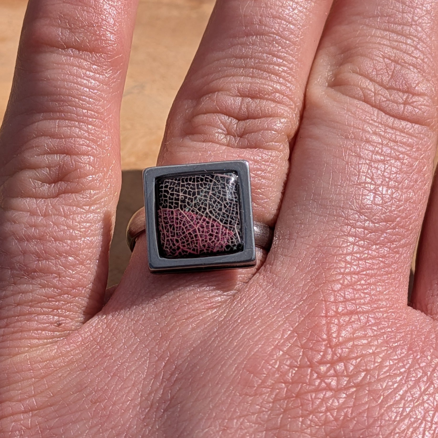 Handcrafted black and burgundy skeleton leaf resin ring on hand, square gunmetal stainless steel setting 14mm – EL-Creations