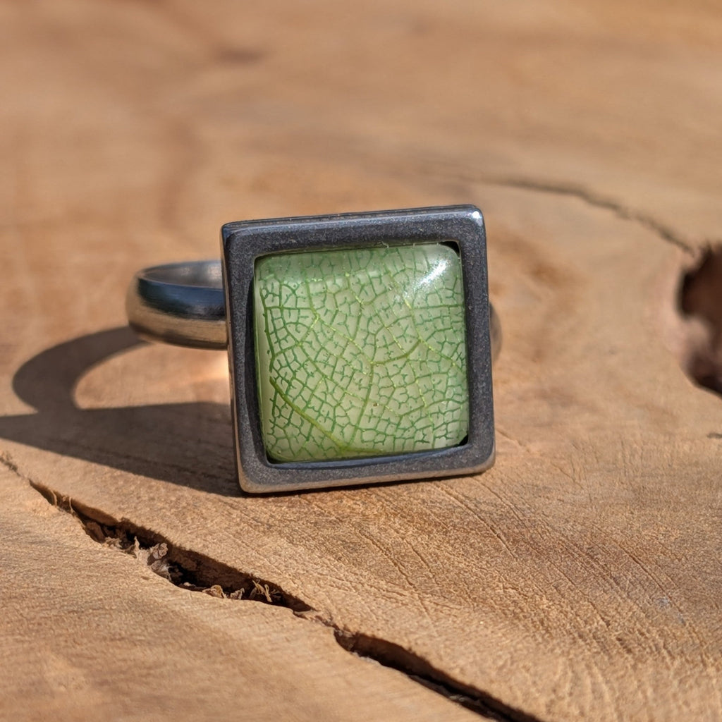 Green skeleton leaf resin ring on wood, 14mm square stainless steel bezel with sage green dome – EL-Creations