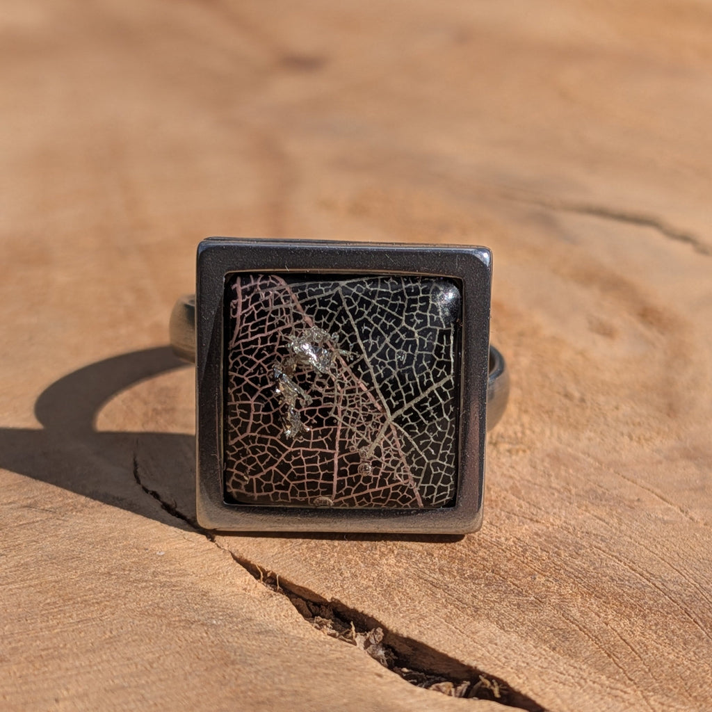 Black skeleton leaf resin ring on wood, 15mm square stainless steel bezel with gloss dome – EL-Creations