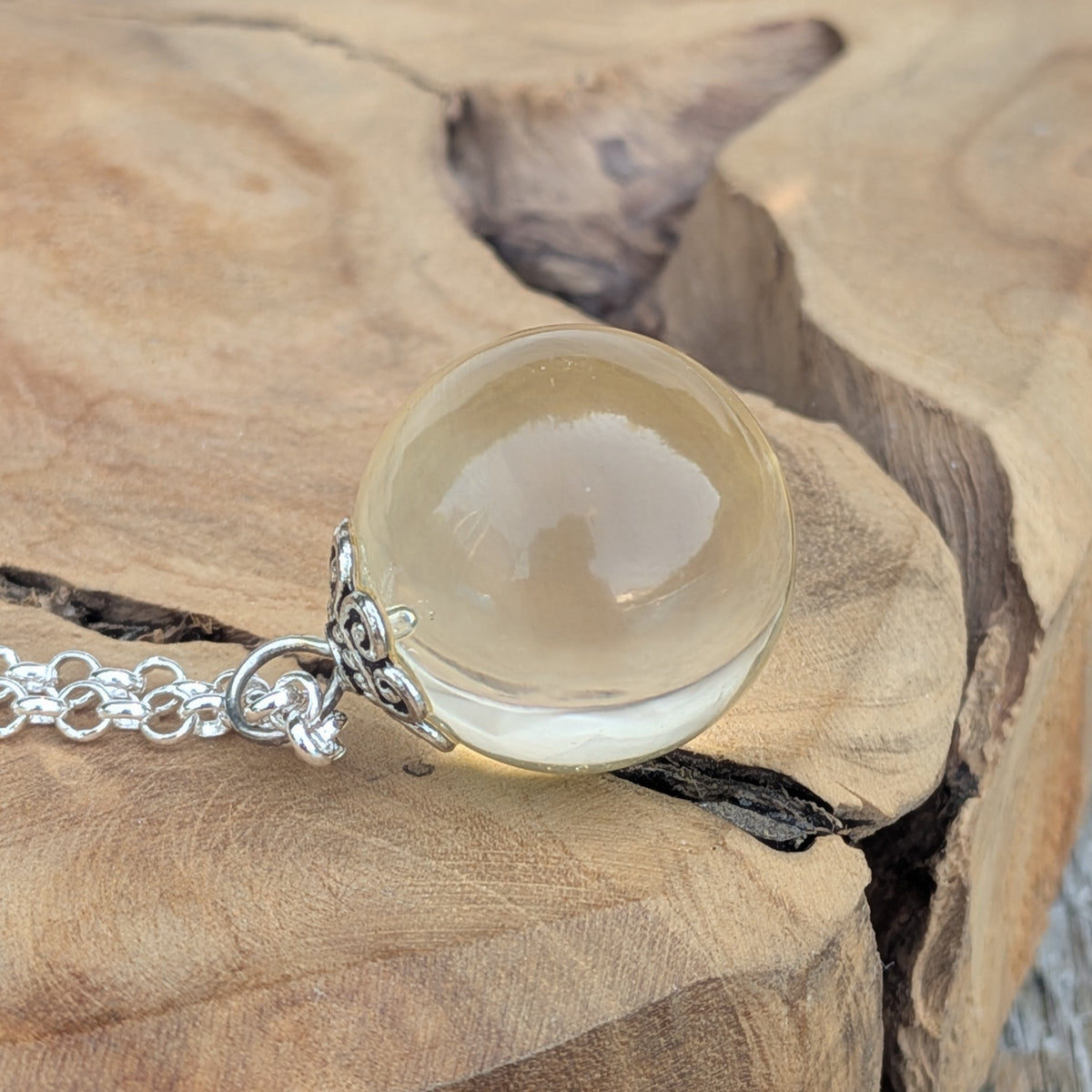Handmade clear resin pendant necklace with silver-toned chain — unique boho jewelry gift