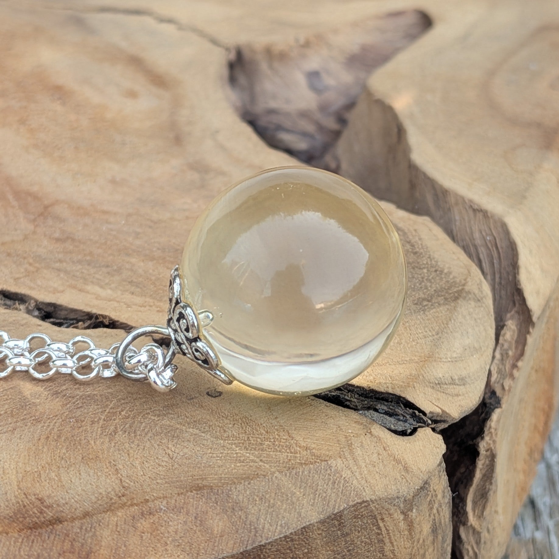 Handmade clear resin pendant necklace with silver-toned chain — unique boho jewelry gift