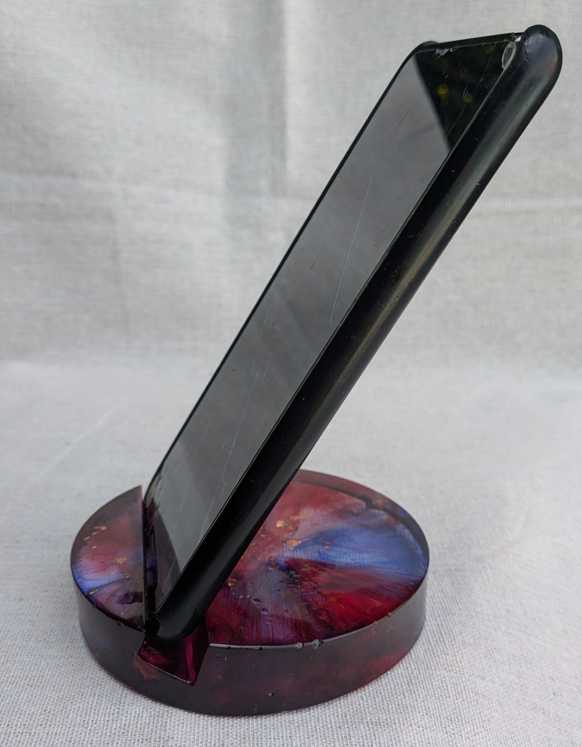 Handmade galaxy phone stand – crimson and dark tones – top view – EL-Creation
