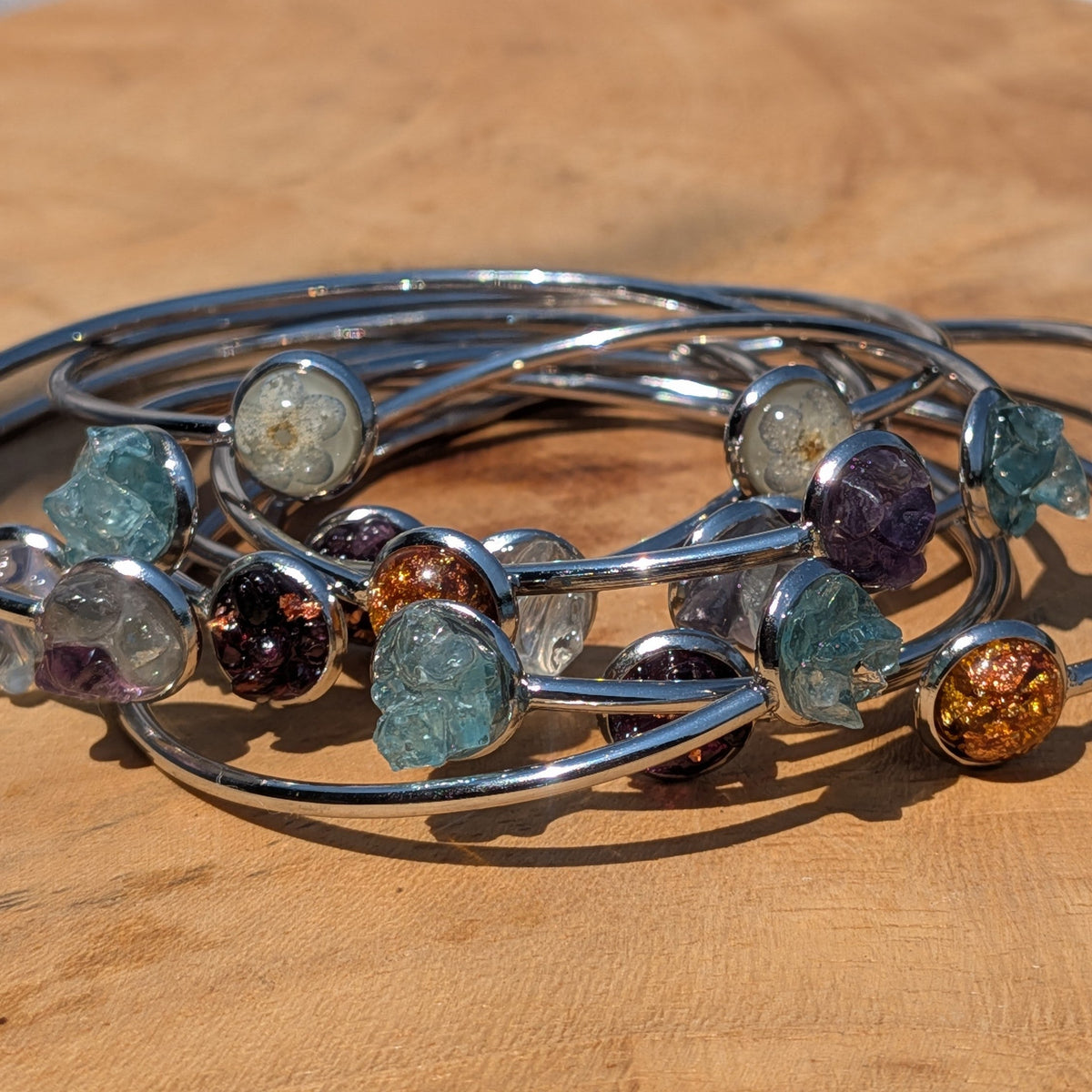 Forget-me-not flower resin cuff bracelet worn on wrist with crystal bracelets – EL-Creations