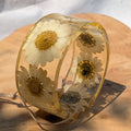 Handmade clear resin bangle bracelet with real pressed white daisies and gold flakes by EL-Creations
