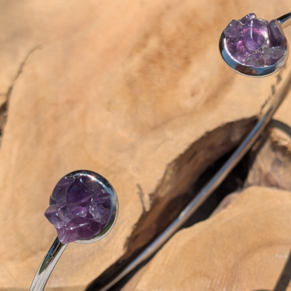 Raw amethyst crystal cuff bracelet on wooden display – EL-Creations