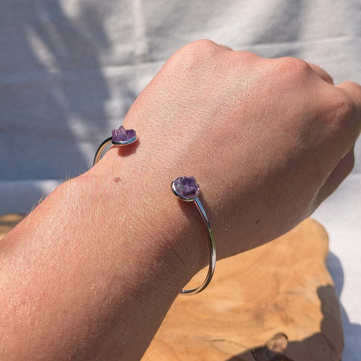 Handmade amethyst cuff bracelet on wrist outdoor natural light – EL-Creations