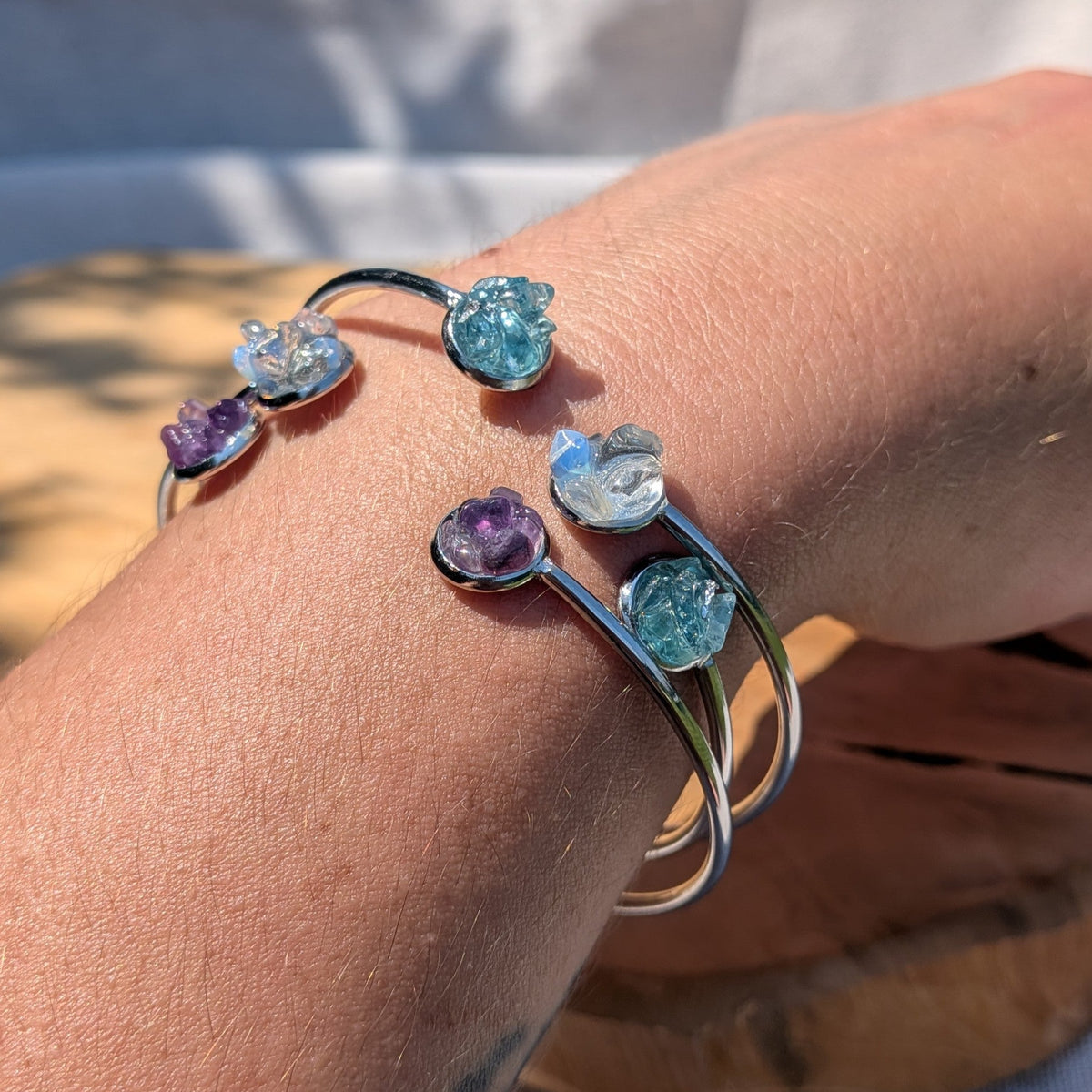Moonstone amethyst topaz cuff bracelets close-up on wrist natural light – EL-Creations