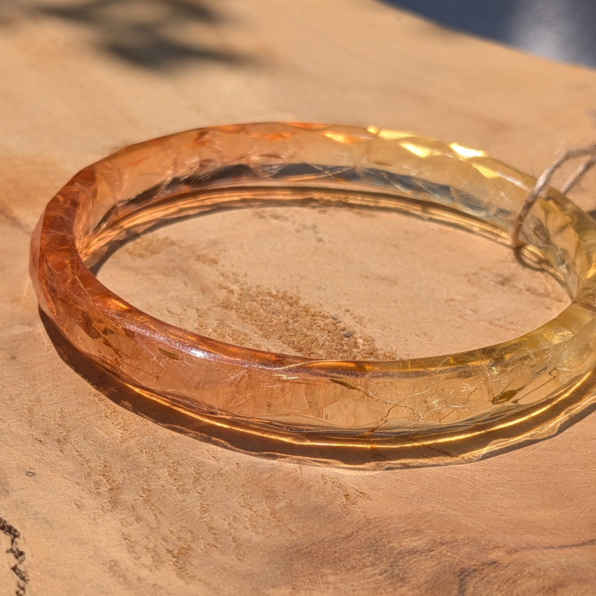 Mint and peach dandelion seed resin cuff bracelet on wooden surface by EL-Creations