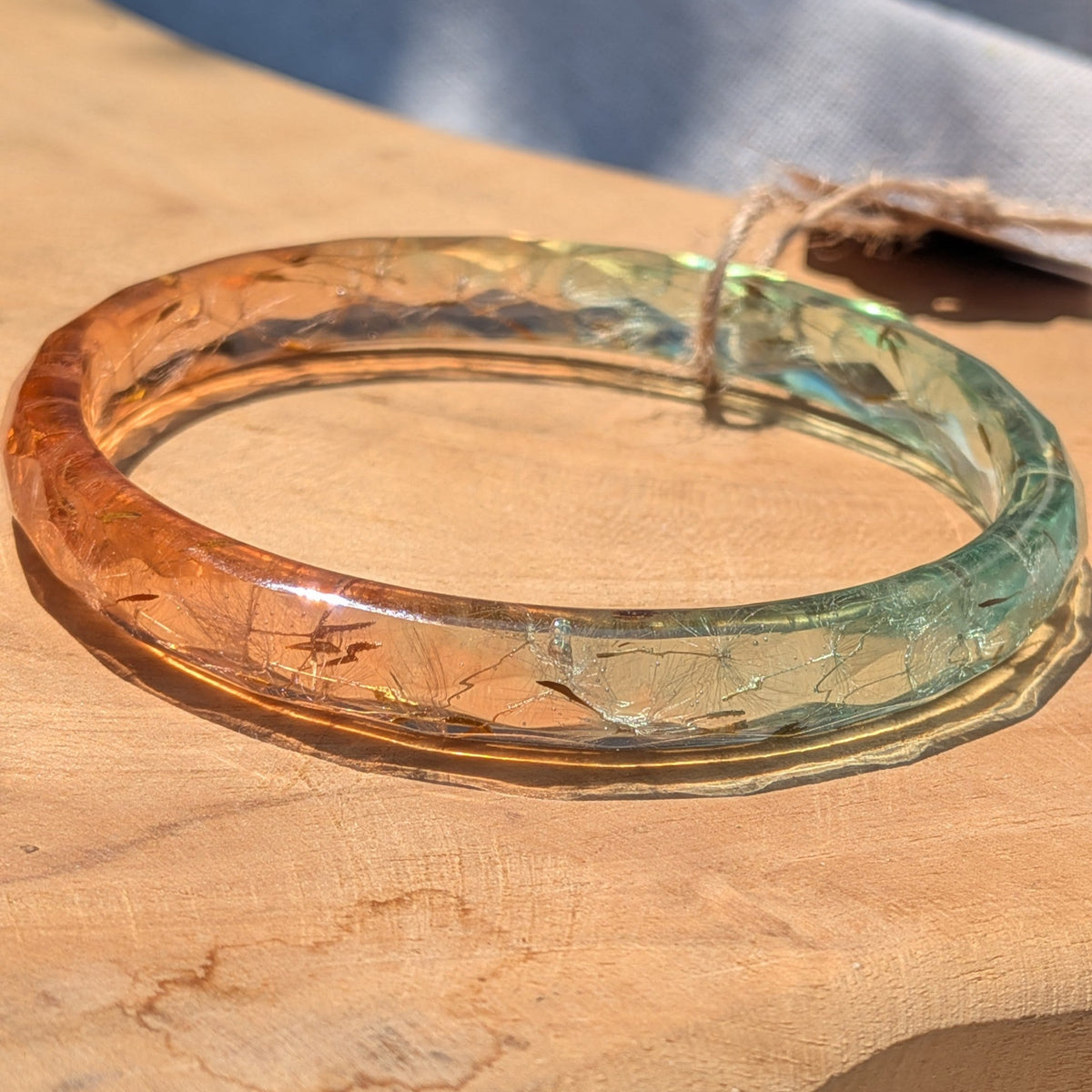 Nature inspired ombre dandelion seed resin bangle in sunlight by EL-Creations