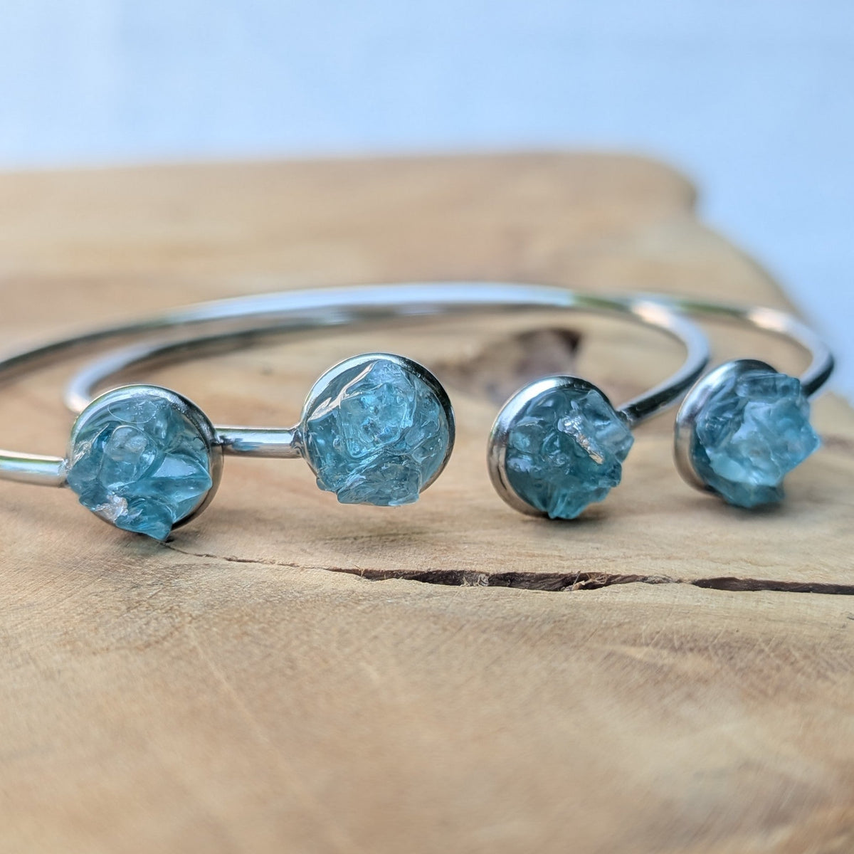 Close-up of raw blue topaz crystal set in stainless steel bezel cuff bracelet – EL-Creations