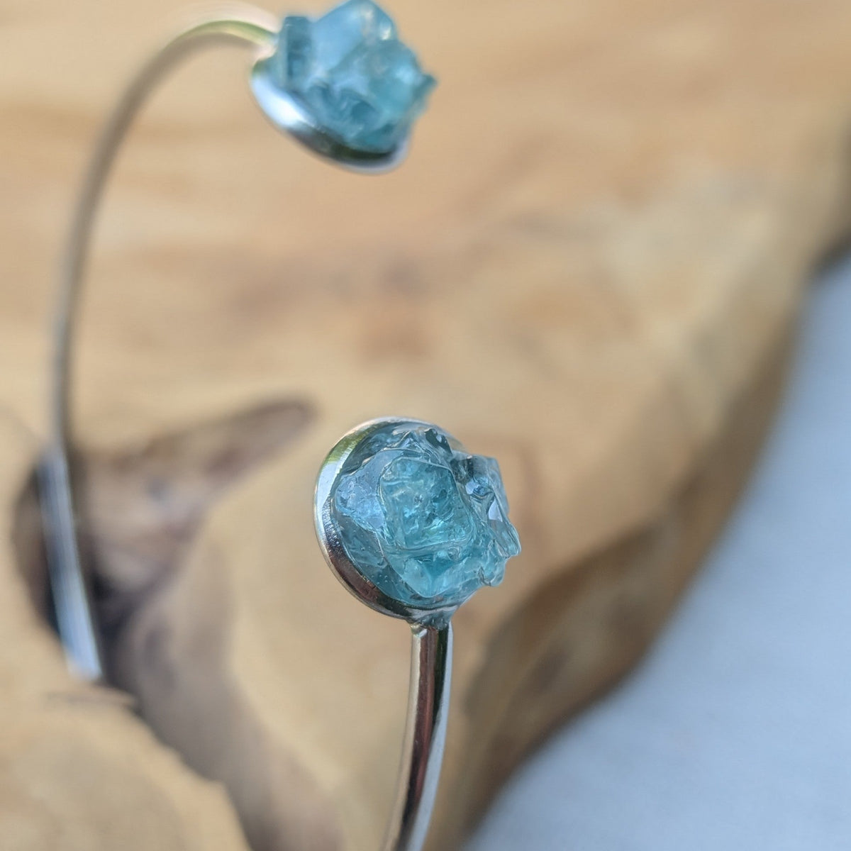 Raw blue topaz open cuff bracelet on driftwood natural light – EL-Creations