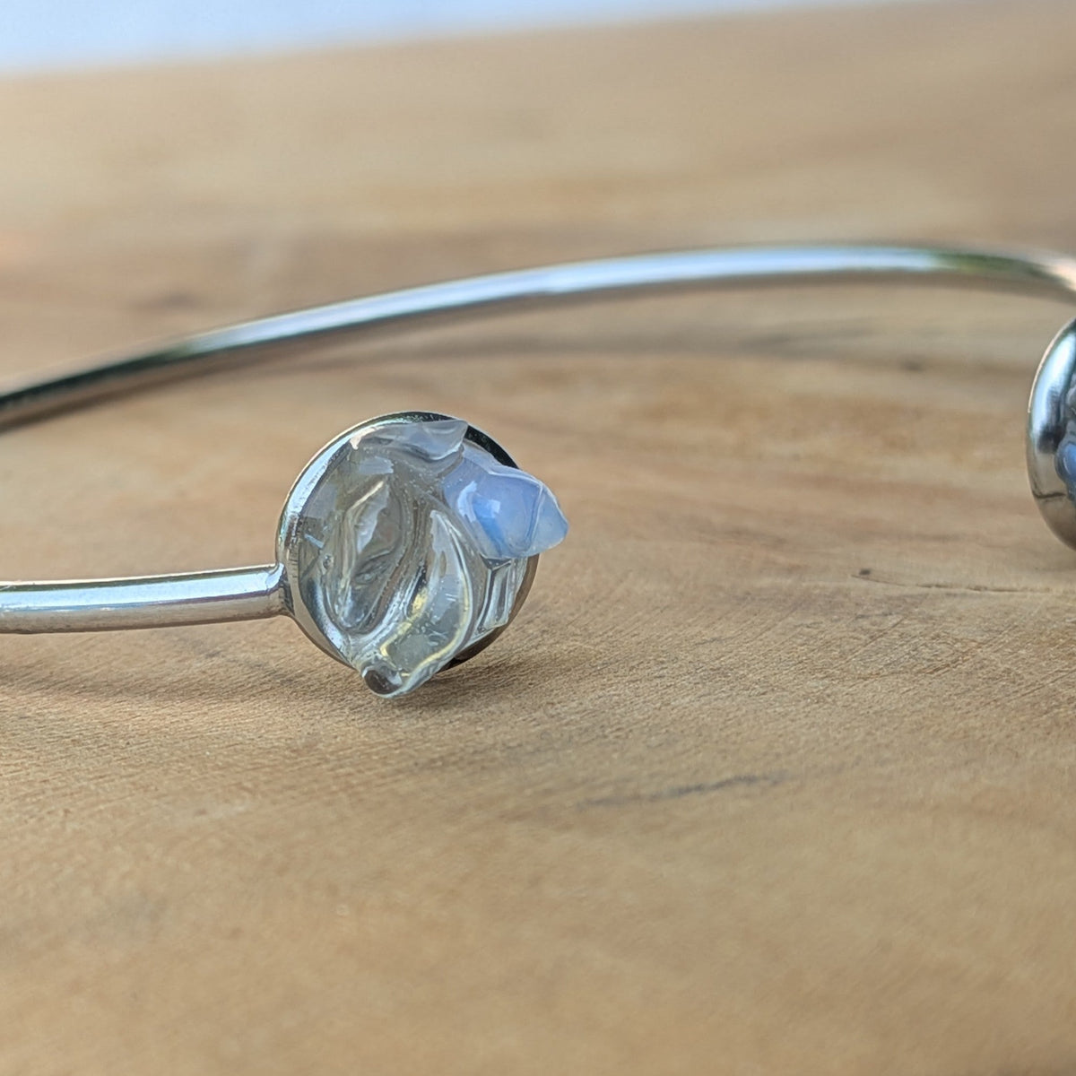 Moonstone crystal cuff bracelet on wrist in sunlight with amethyst and topaz – EL-Creations