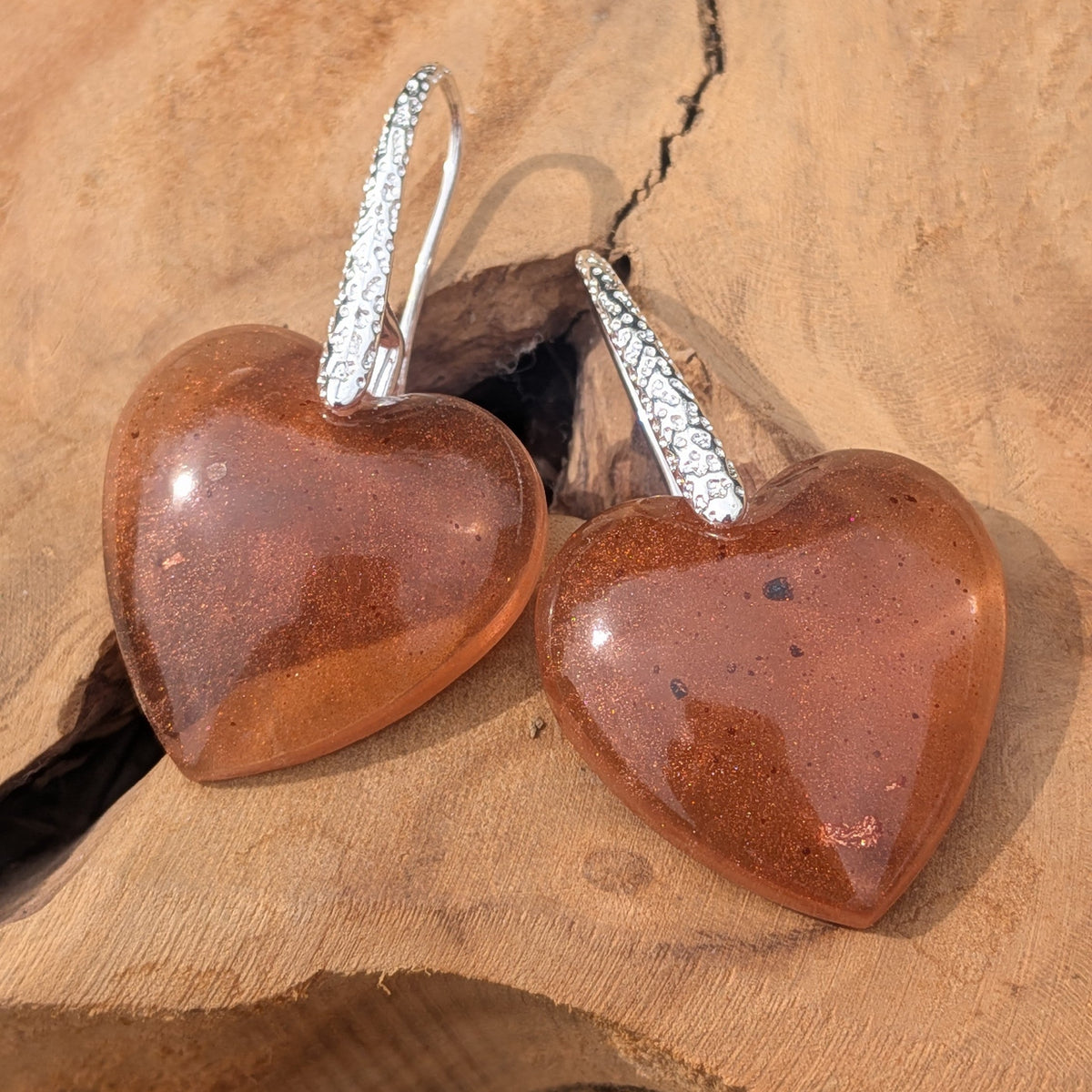 Handmade chunky heart resin earrings brown copper flakes textured silver hooks on driftwood outdoor – EL-Creations