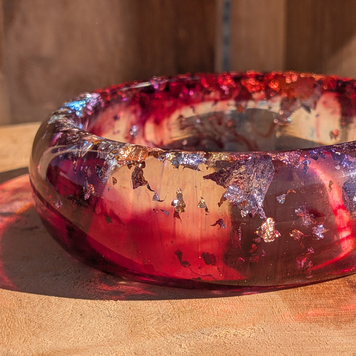 Red purple resin statement bangle worn on wrist close-up showing 23mm width and high-gloss surface – EL-Creations