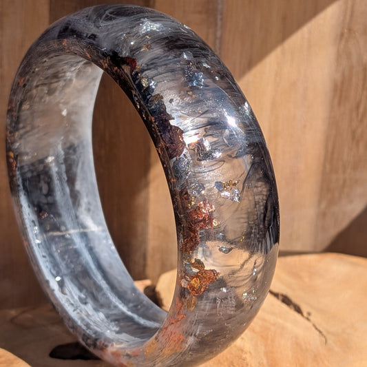 Black white resin dome bangle side view showing 23mm width and chunky dome profile on wood – EL-Creations