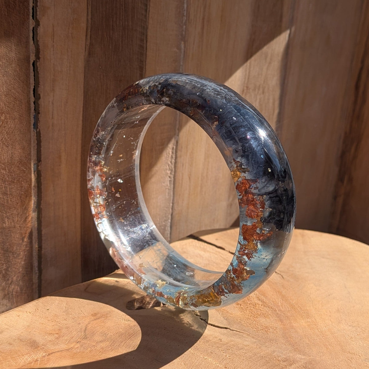 Handmade blue resin bangle 4mm thin profile worn on wrist outdoor showing full width and gloss finish – EL-Creations