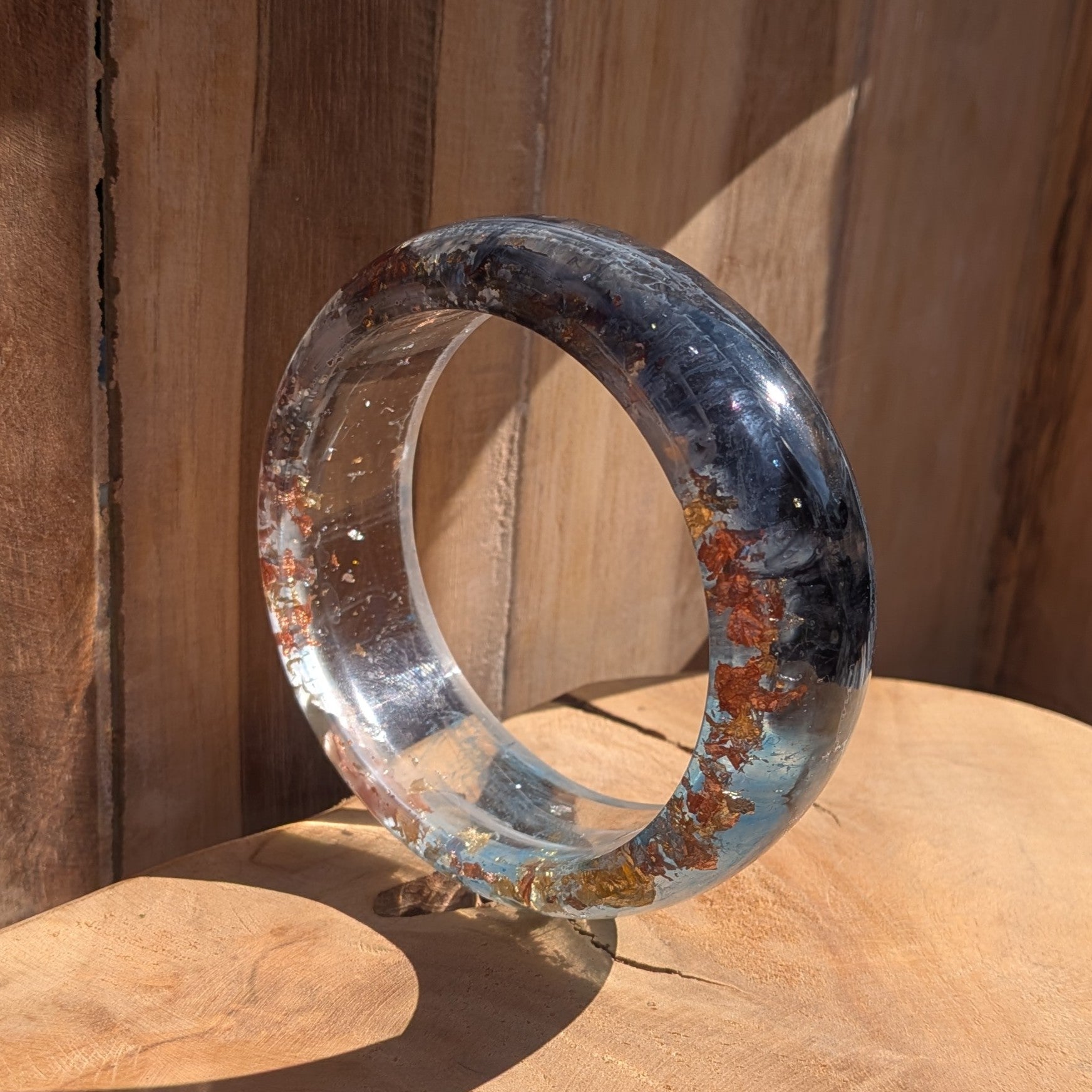Handmade blue resin bangle 4mm thin profile worn on wrist outdoor showing full width and gloss finish – EL-Creations