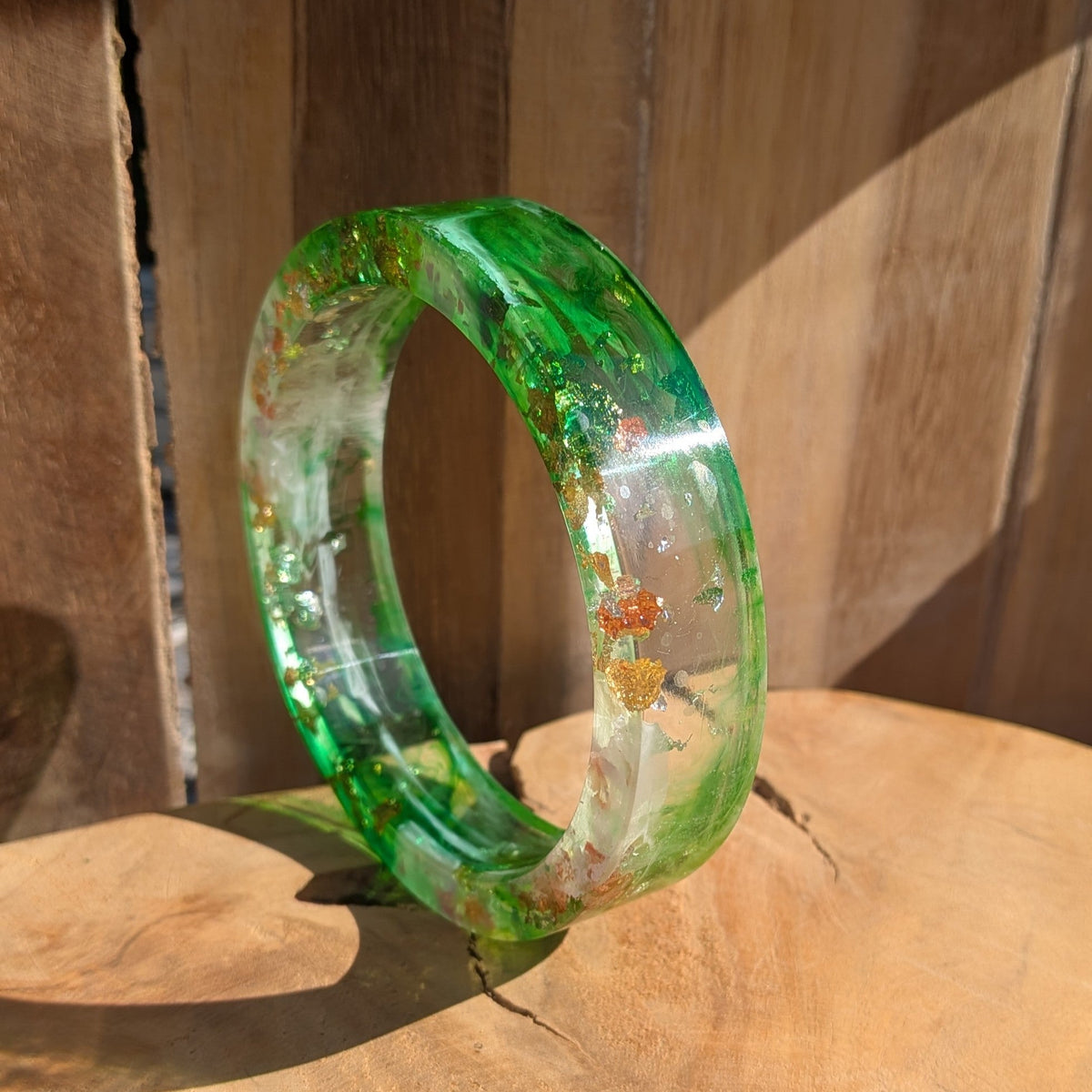 Green resin bangle close-up side profile on wrist showing 7mm thickness and polished edge – EL-Creations
