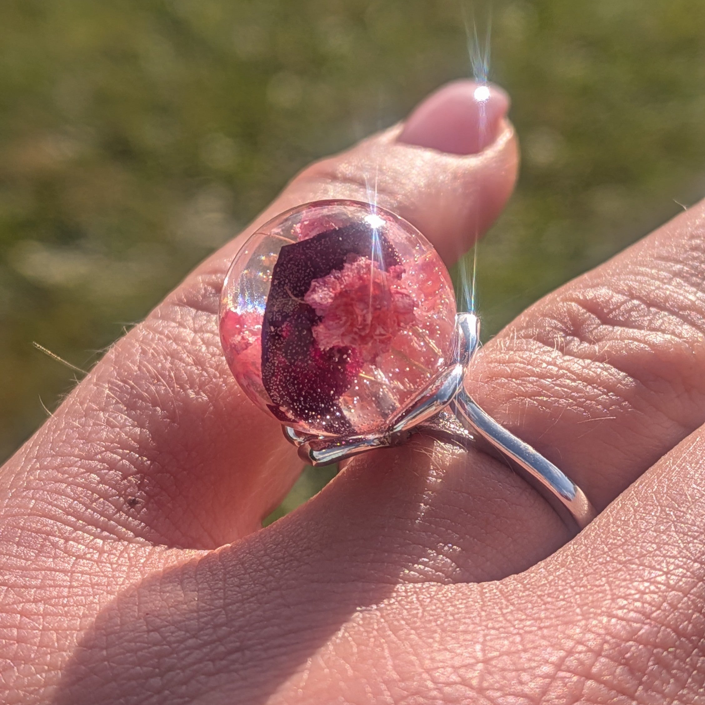 Silver adjustable resin ring with baby's breath and rose petals worn on hand – EL-Creations