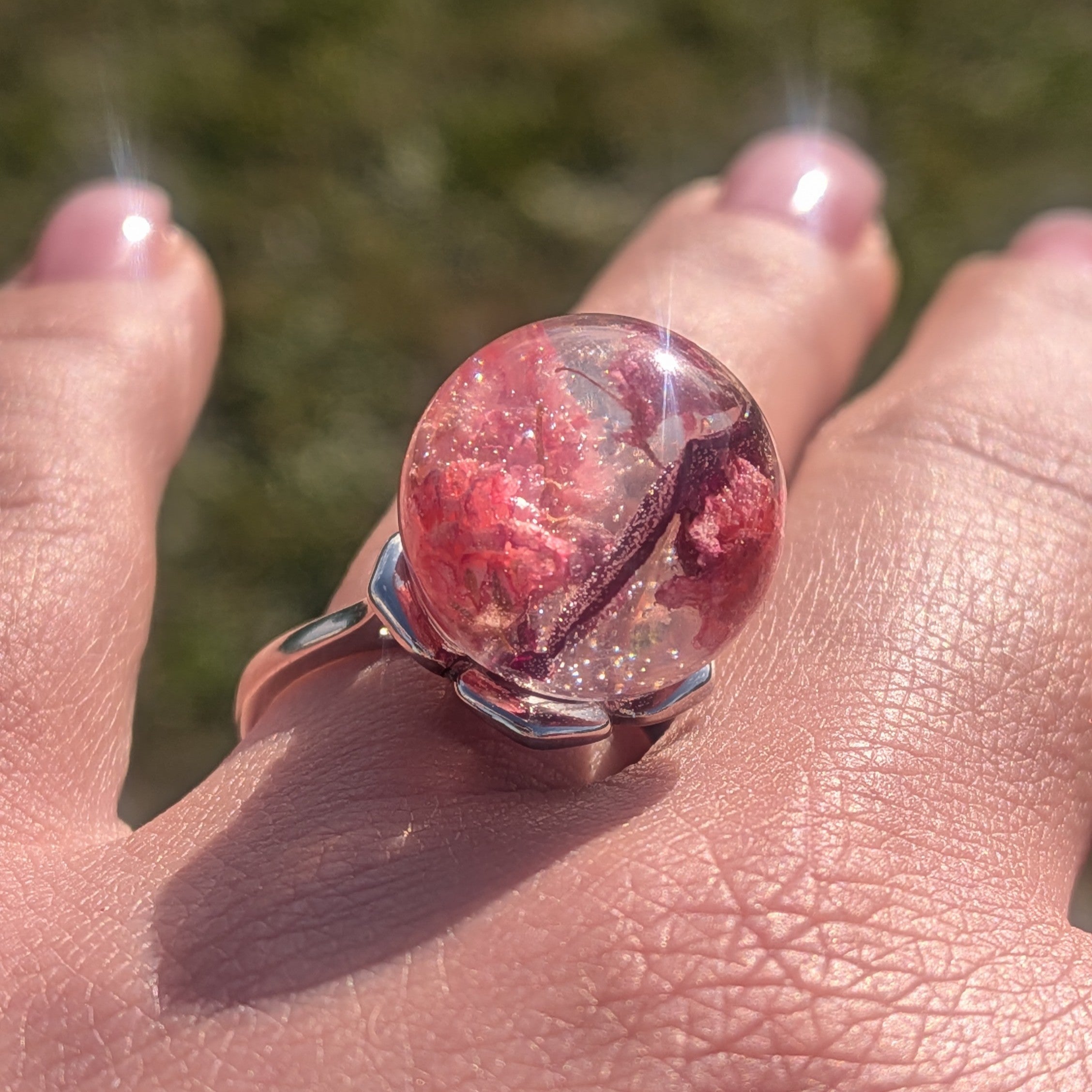 Handmade botanical resin ring with baby's breath and rose petals – full hand view – EL-Creations