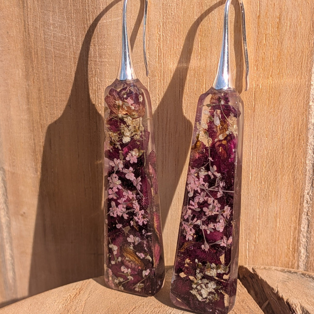 Handmade burgundy resin dangle earrings with rose petals and Queen Anne's Lace – close-up – EL-Creations