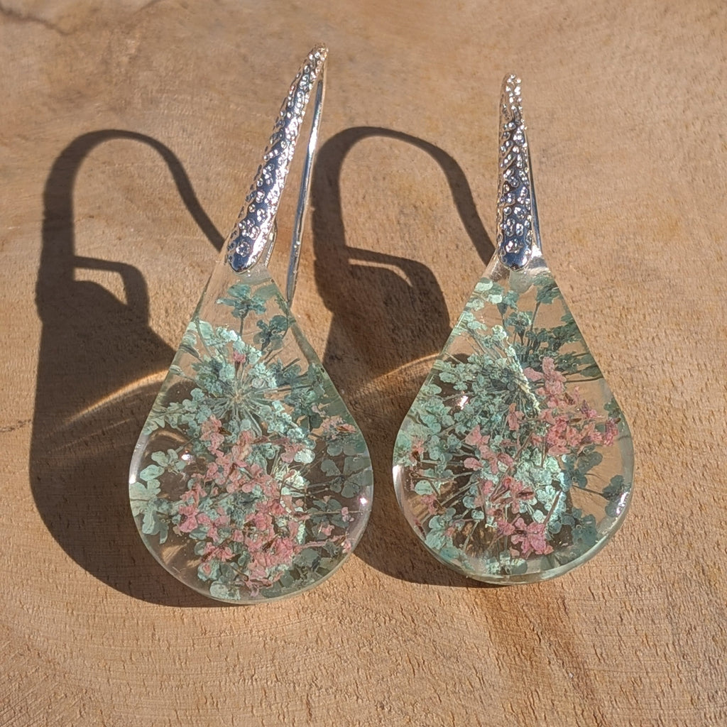 Queen Anne's Lace resin teardrop earrings on stone diagonal view silver crystal hooks – EL-Creations