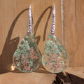 Queen Anne's Lace resin earrings silver crystal lever-back hooks front view on stone surface – EL-Creations