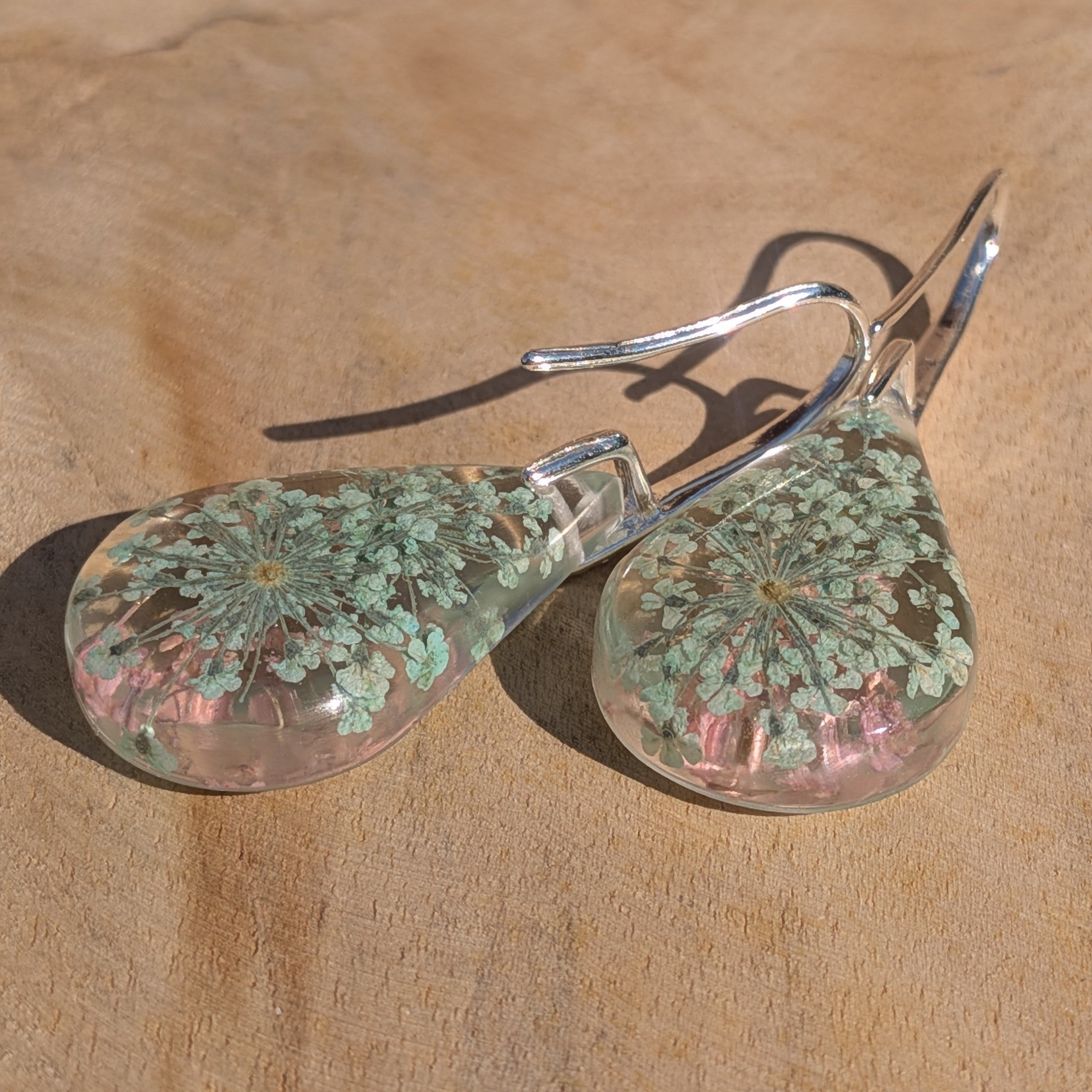 Queen Anne's Lace resin earrings pair on stone in natural light blush pink mint green detail – EL-Creations