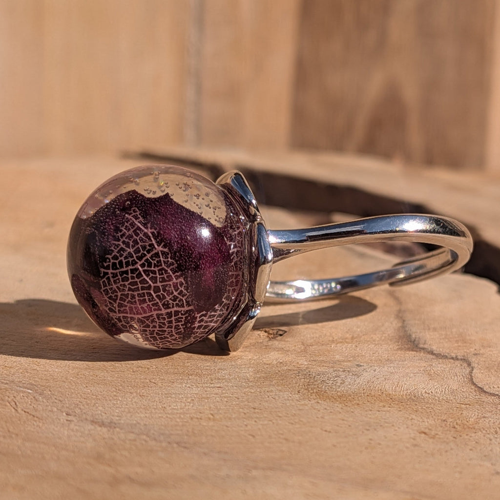 15mm resin ball ring with dried rose petals and skeleton leaf worn on finger – EL-Creations