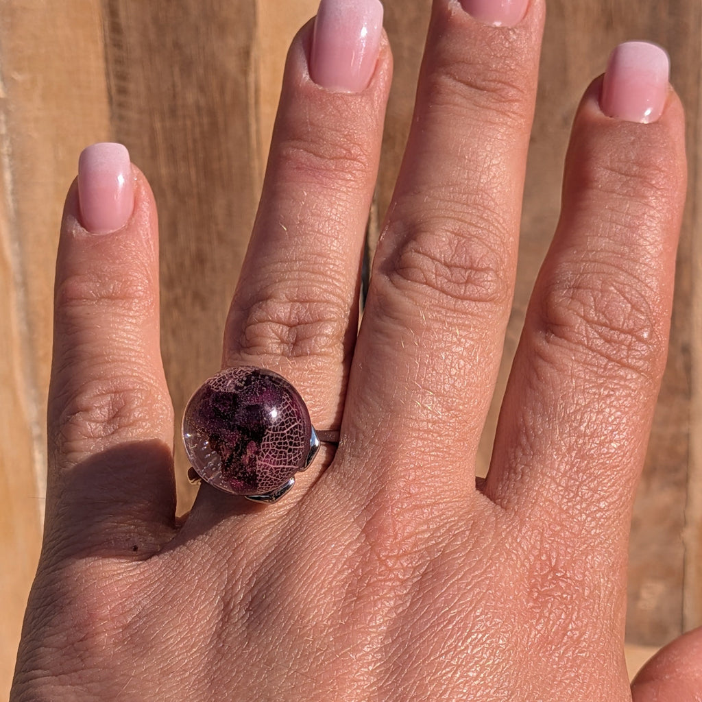 Handmade resin ball ring with rose petals and skeleton leaf – full hand view – EL-Creations