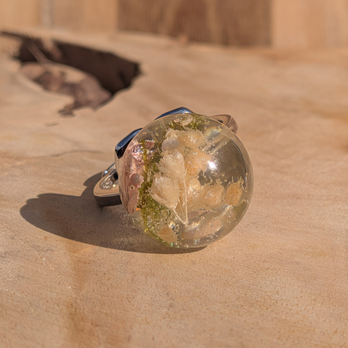 Botanical globe ring worn on hand – pressed flower resin jewelry – EL-Creations