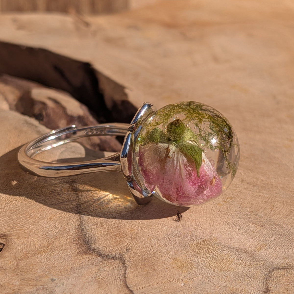 Clear resin sphere ring showing vivid pink rose petal and green moss detail – EL-Creations