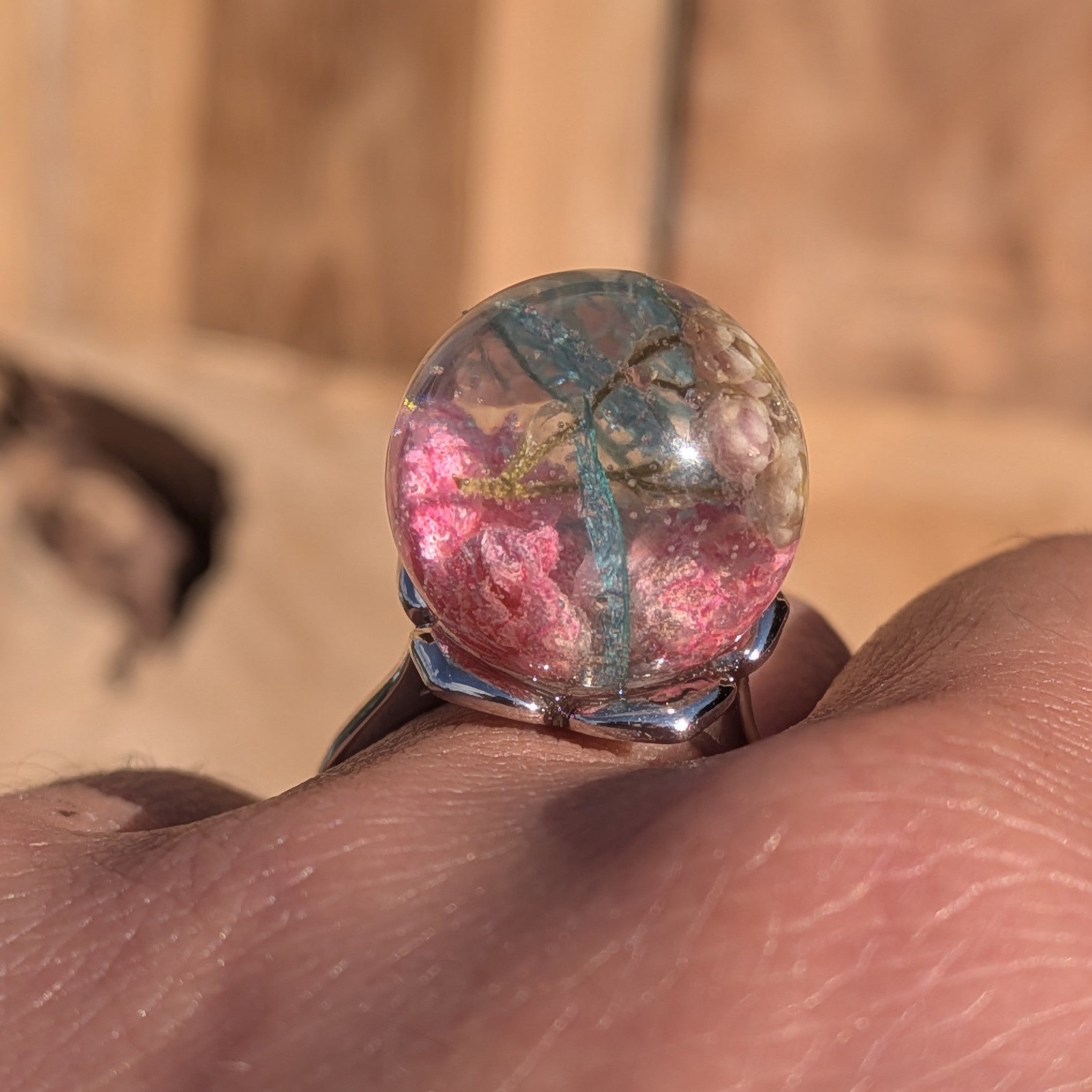 Clear resin globe ring with pressed baby's breath, skeleton leaf and pink wildflower on silver adjustable band – EL-Creations