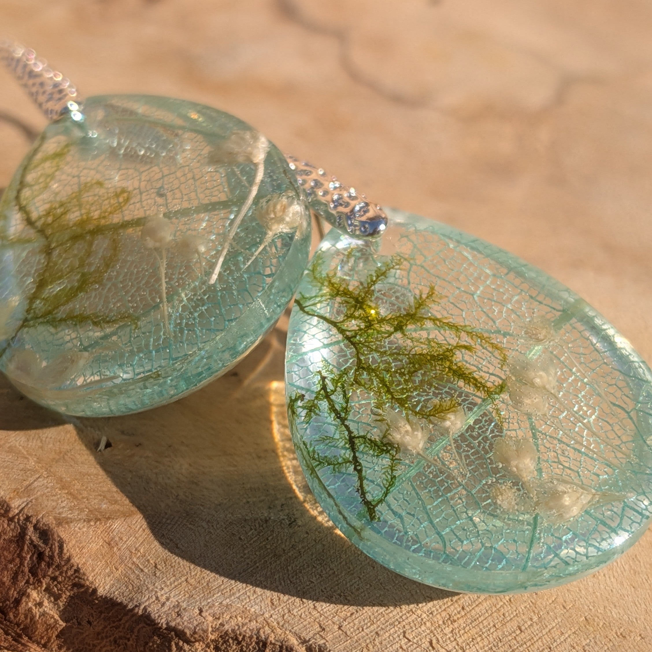 Skeleton leaf resin earrings aqua teardrop pair on wood top view botanical detail – EL-Creations