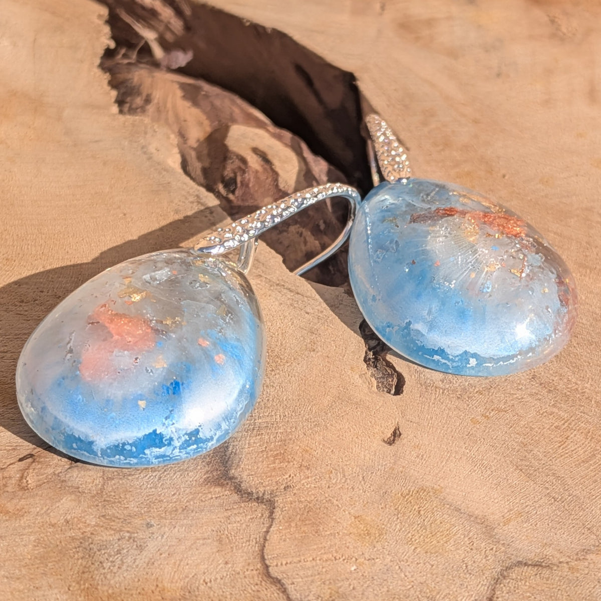 Pair of blue and white resin teardrop earrings with textured silver hooks, EL-Creations