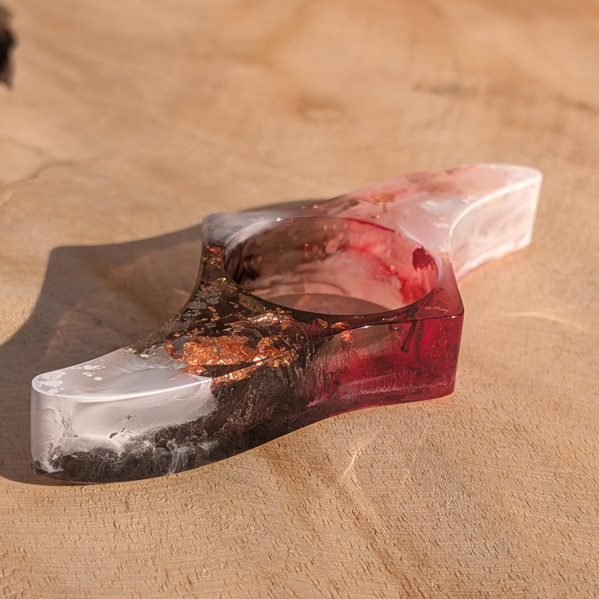 Handmade resin reading ring with copper shimmer – three quarter view on wooden surface – EL-Creations