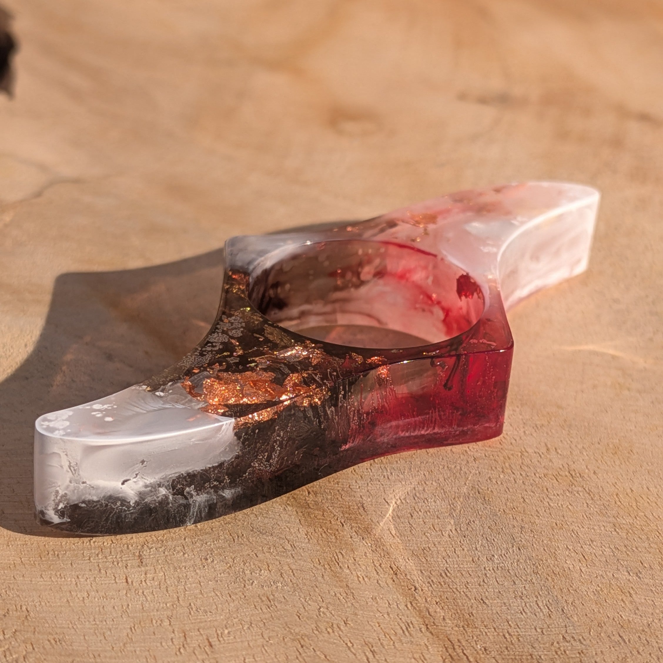 Handmade resin reading ring with copper shimmer – three quarter view on wooden surface – EL-Creations