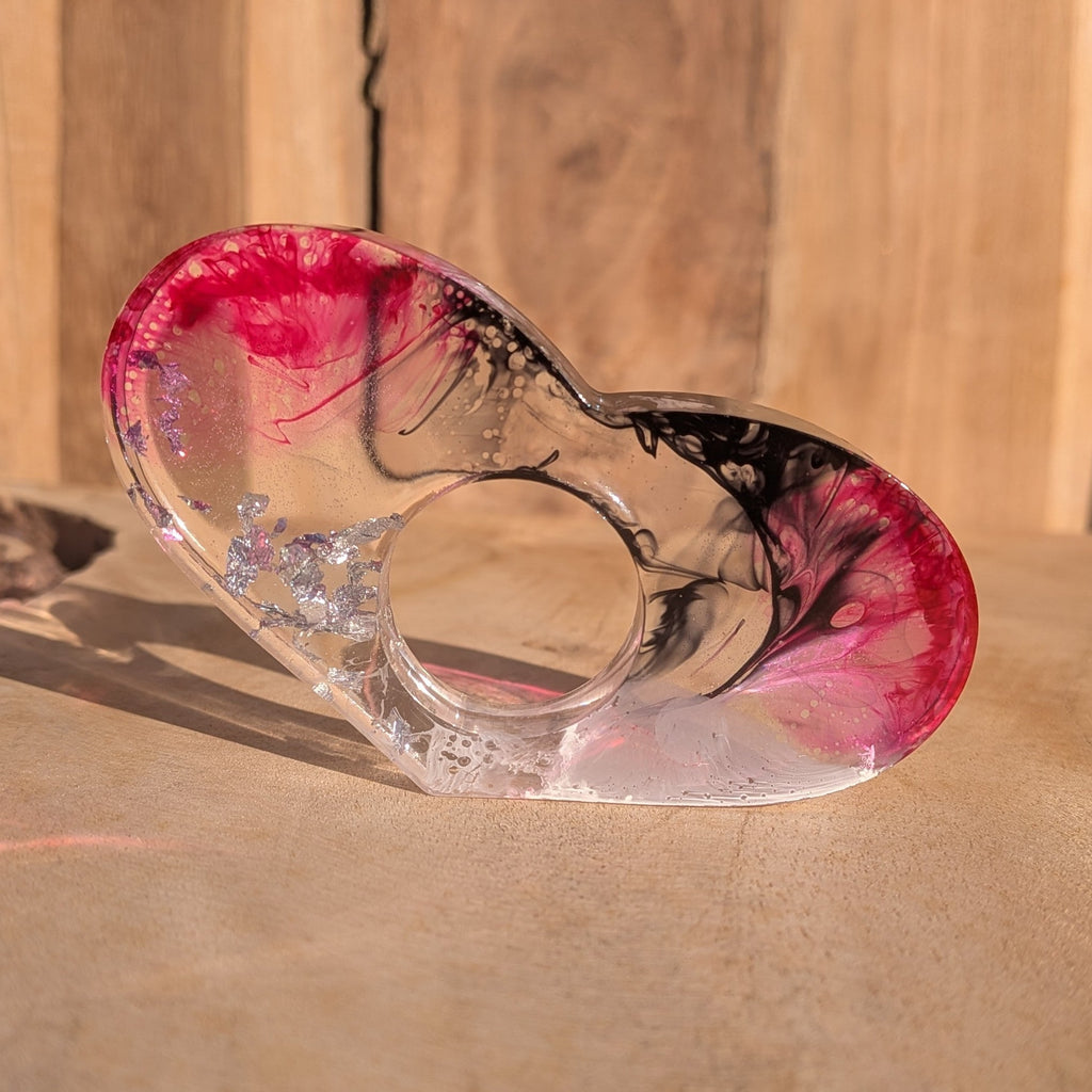 Oversized resin book ring with crimson and black pigment inks – back view on wooden surface – EL-Creations