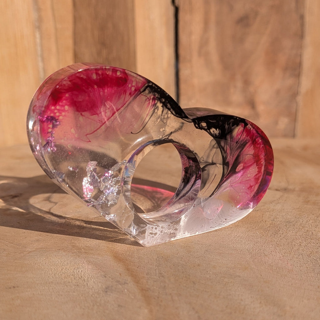 Large handmade resin reading ring with silver flakes – low angle view in sunlight – EL-Creations