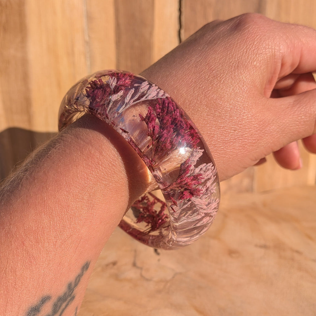 Handmade resin flower bangle worn on wrist – lifestyle shot showing fit and scale – EL-Creations