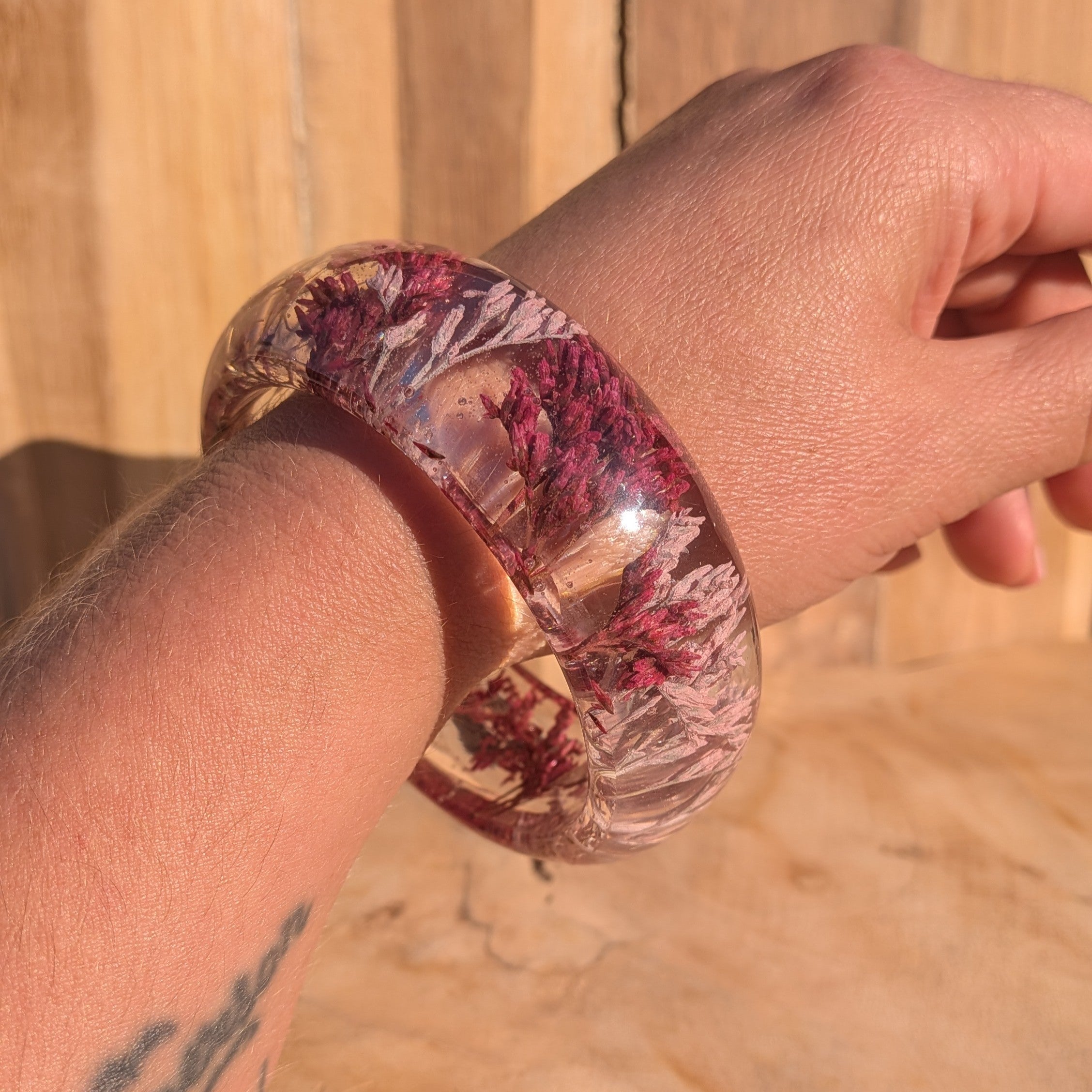 Handmade resin flower bangle worn on wrist – lifestyle shot showing fit and scale – EL-Creations